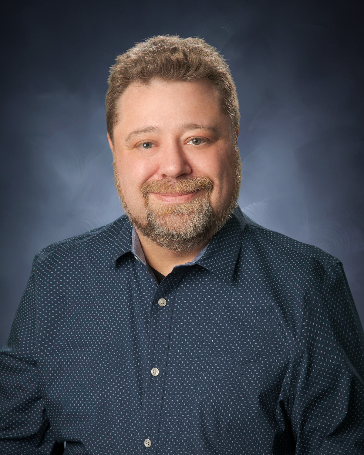 Photo of the waist up of Chad Dumont.